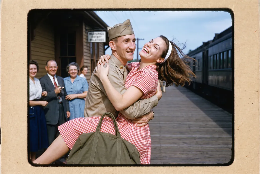 Walt home from two years in the Army in Germany, lifting Peggy off her feet at the depot, 1960.